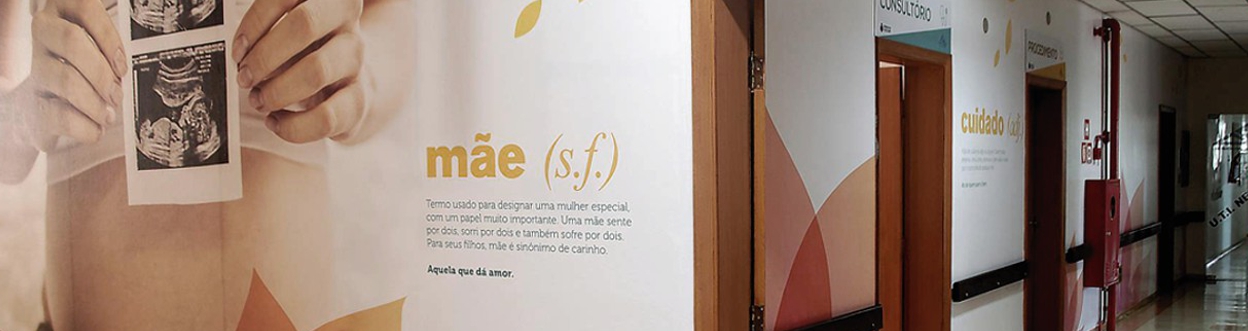 Two doctors smiling, one male doctor holding stethoscope, one female doctor holding clipboard, on light blue background with rounded corners